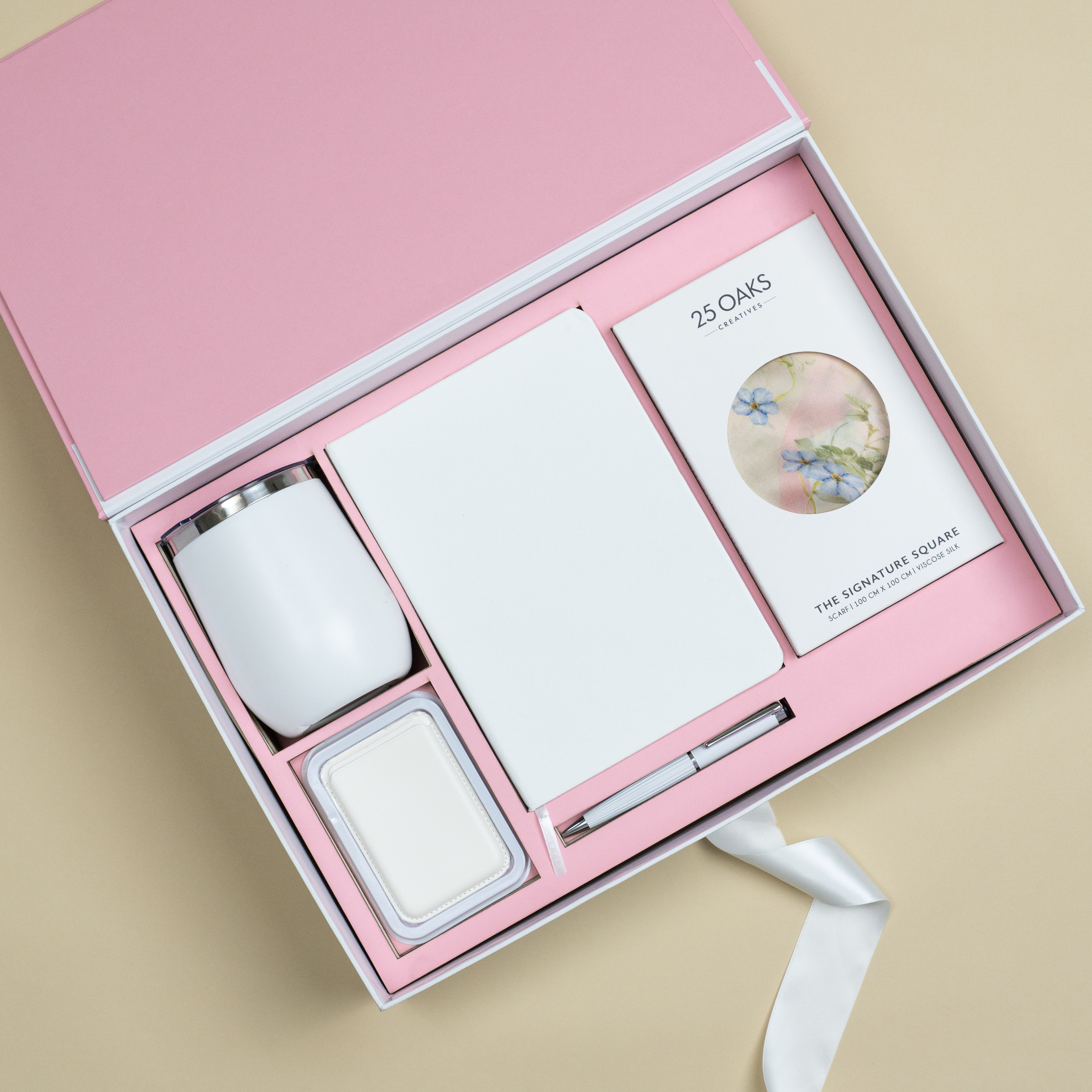 The Rosewood premium corporate gift set with white vacuum flask, A5 diary, scarf, MagSafe card holder and white pen.