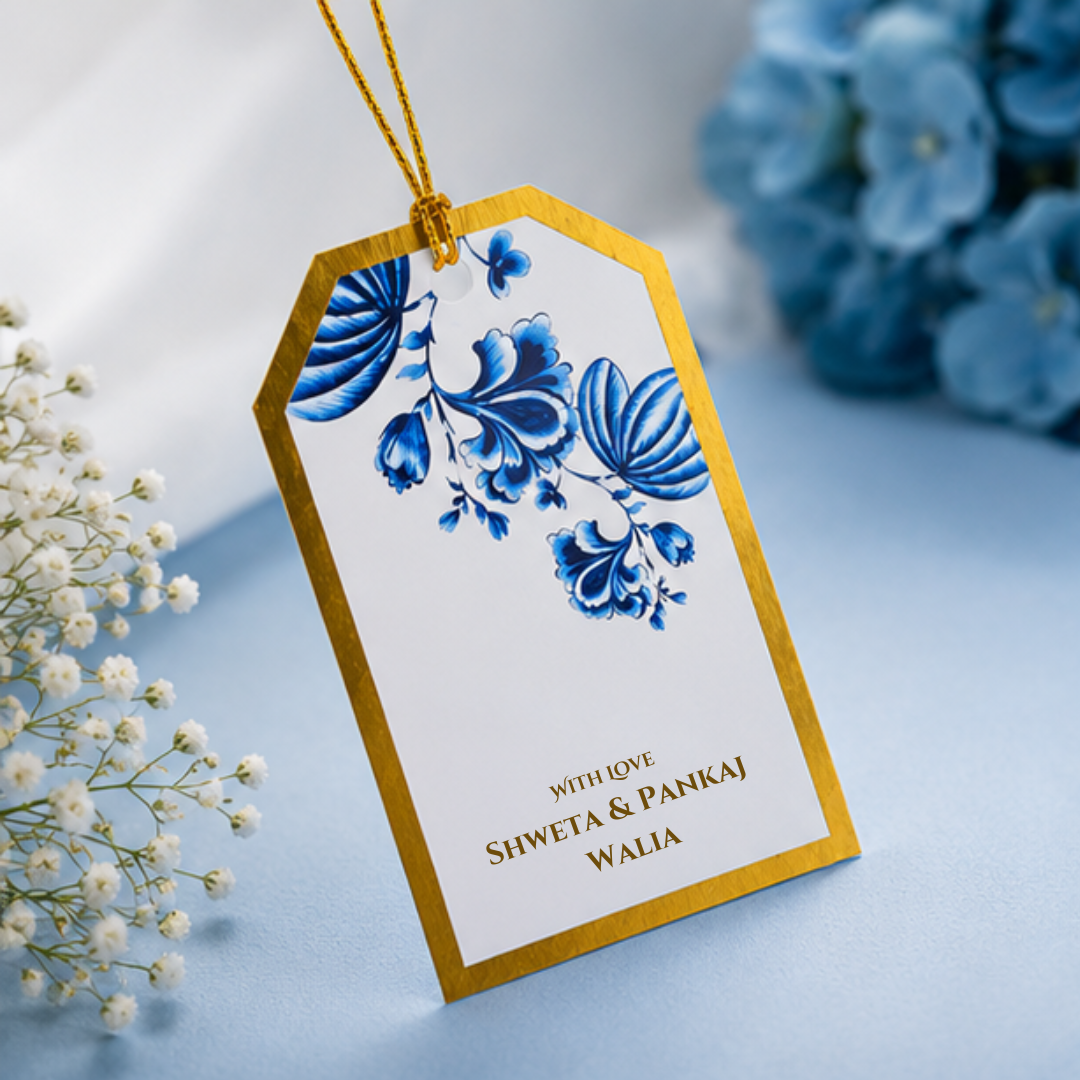Elegant blue floral hanging gift tag with intricate botanical artwork, gold border detailing, and luxurious golden dori for premium gifting.