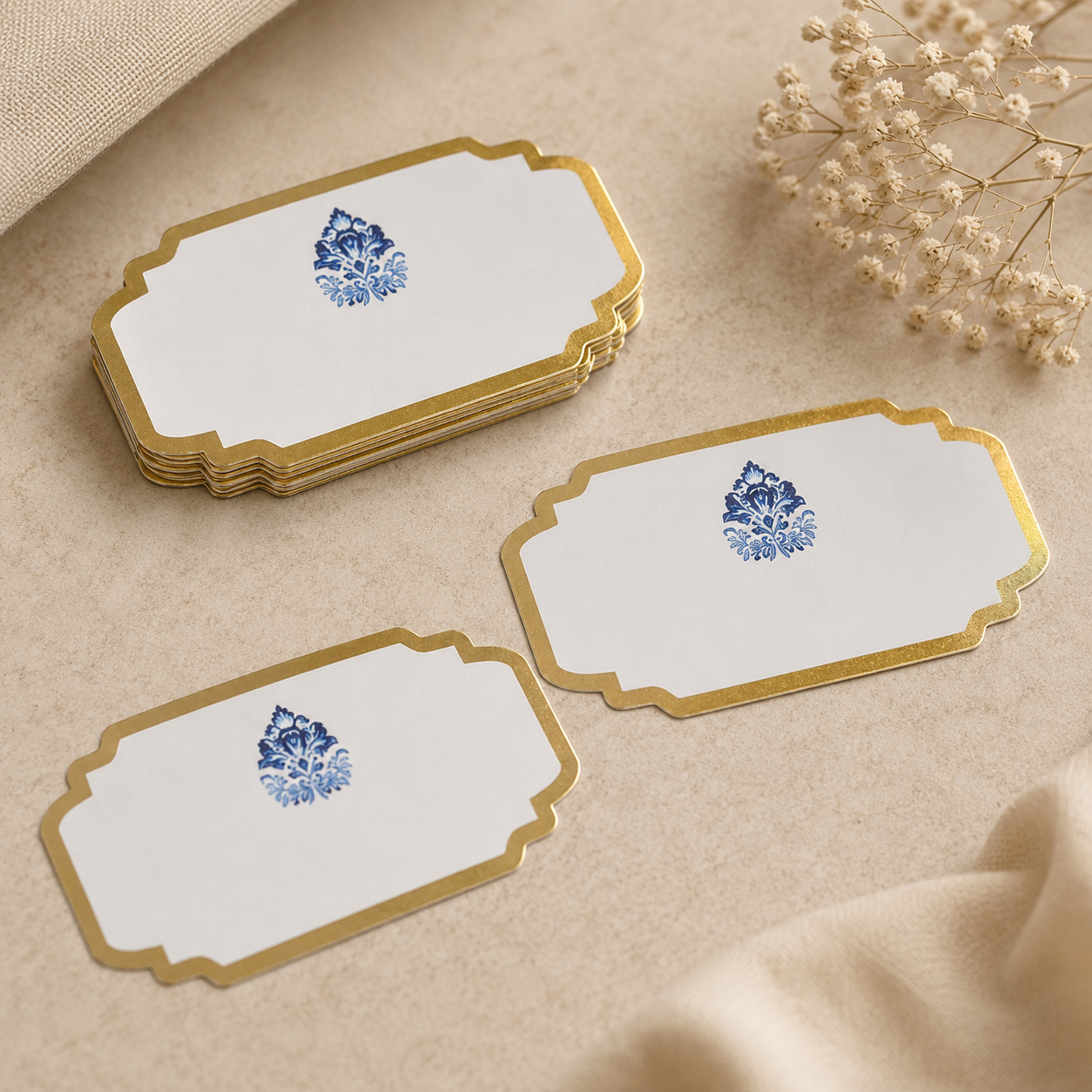 Minimal luxury sticker tag with intricate blue botanical artwork and refined gold edges, perfect for weddings, festive gifting, and hampers.