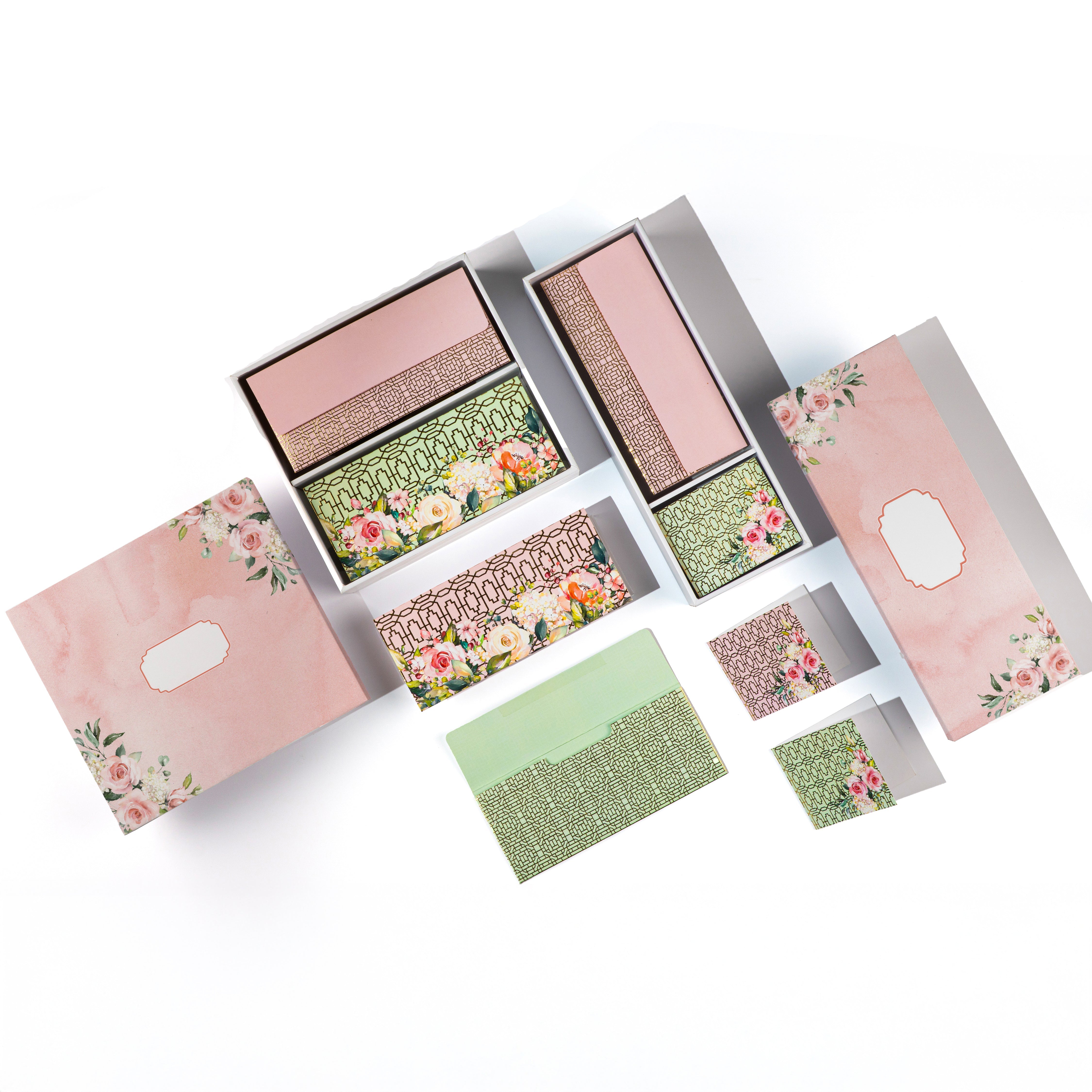 Pink floral stationery gift set with printed folded cards andenvelopes.
