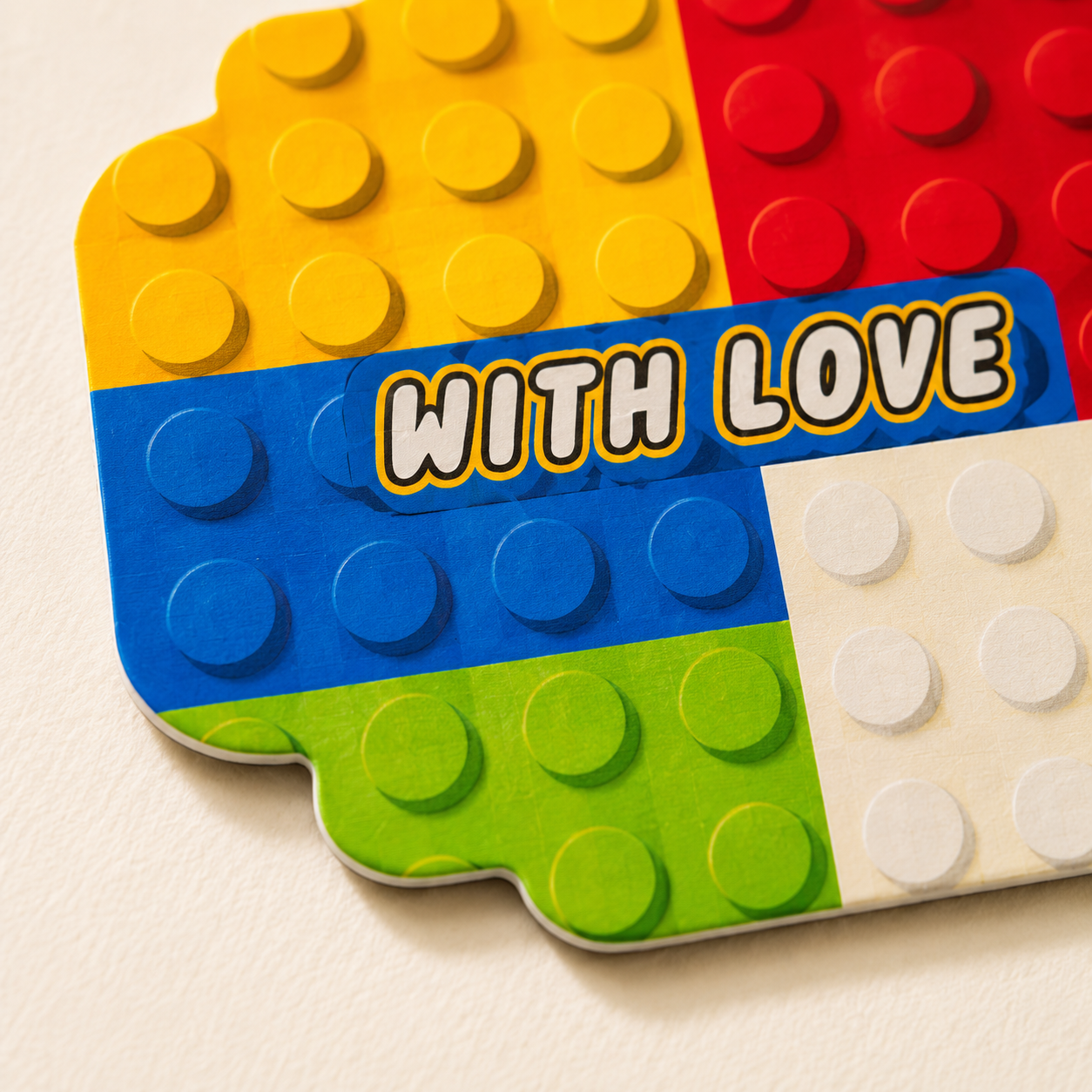 Fun LEGO-inspired sticker tag featuring bright primary colors and playful block patterns for birthday gifts and party favors.