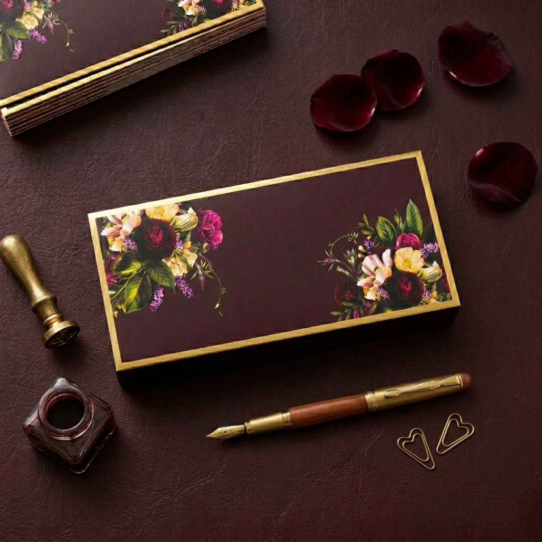 Luxurious money envelopes in deep blue and maroon, adorned with elegant winter florals and gold details. 