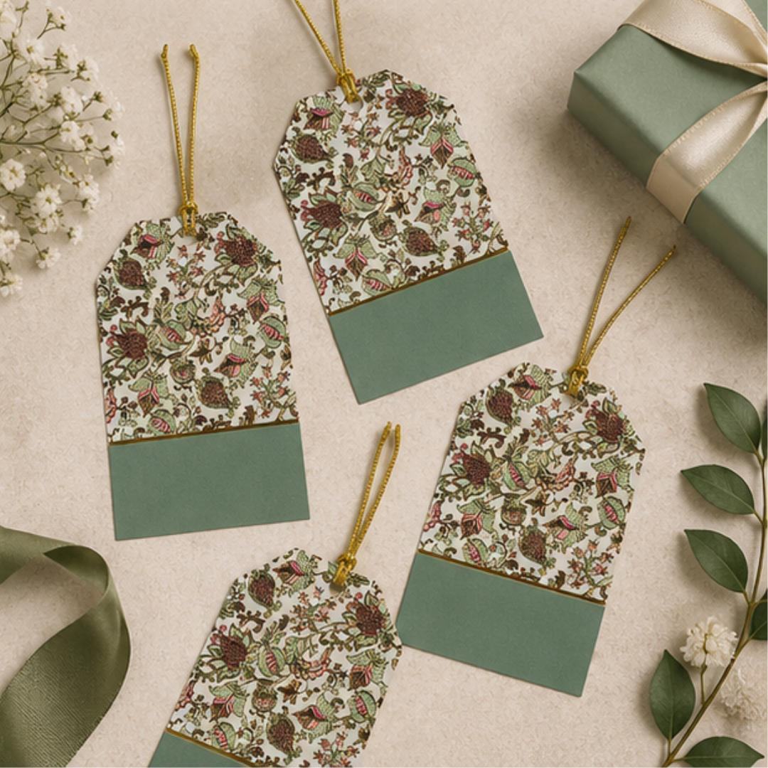 Sophisticated patterned hanging tags displayed with pastel green gift bags and soft neutral props for premium gifting inspiration.