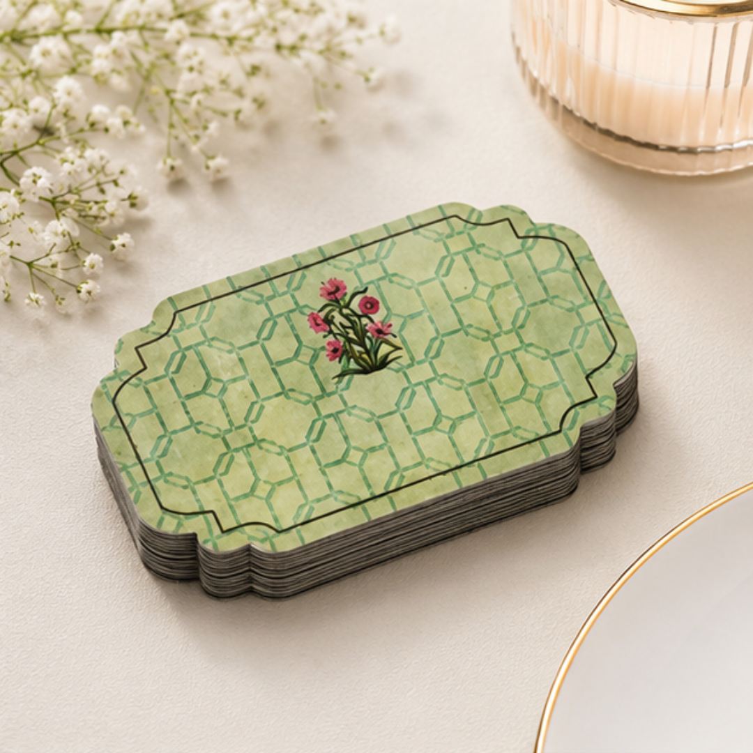 Premium green peel and stick gift sticker displayed on gift boxes and envelopes with refined floral and lattice-inspired artwork.