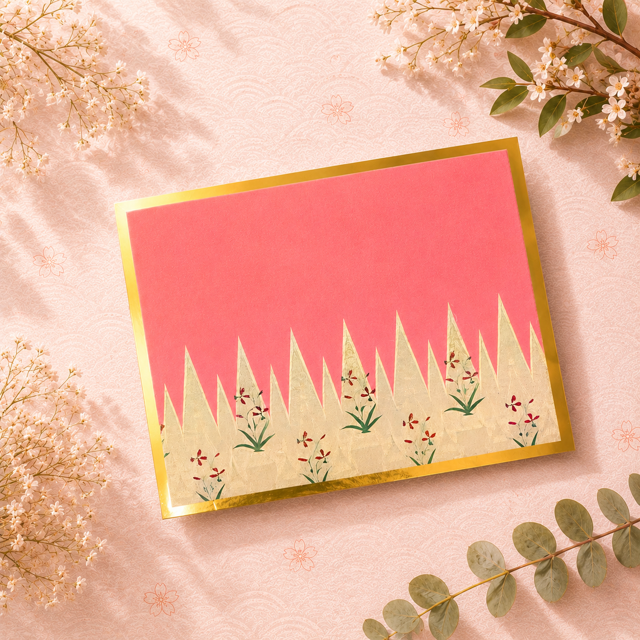 Elegant folded greeting card in vibrant pink tones featuring abstract botanical motifs and refined wedding stationery styling.