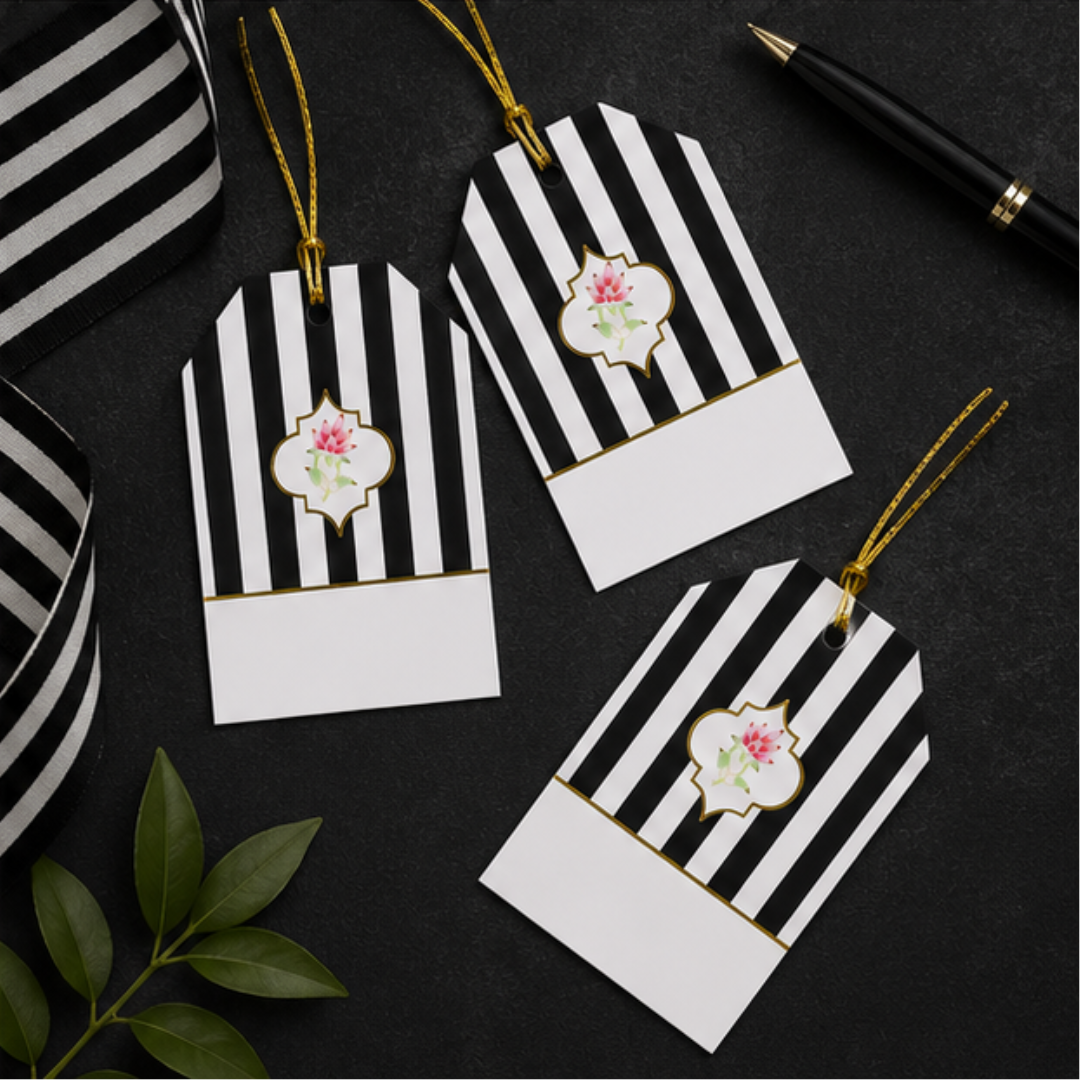 Luxury striped gift tags with golden dori and minimal floral artwork, beautifully arranged on sleek black backgrounds.