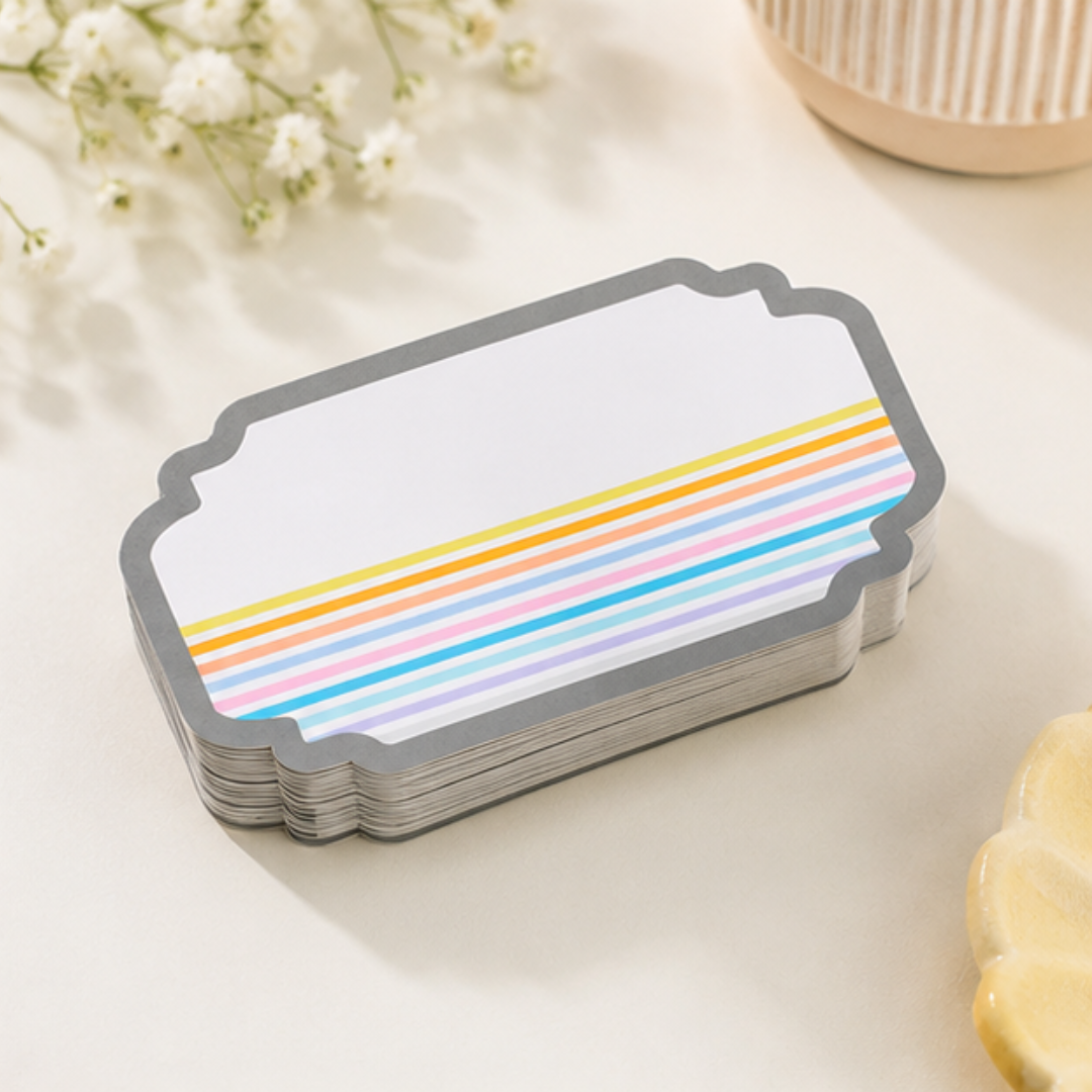 Elegant pastel rainbow gift sticker with minimal geometric detailing and scalloped edges for stylish festive gifting.