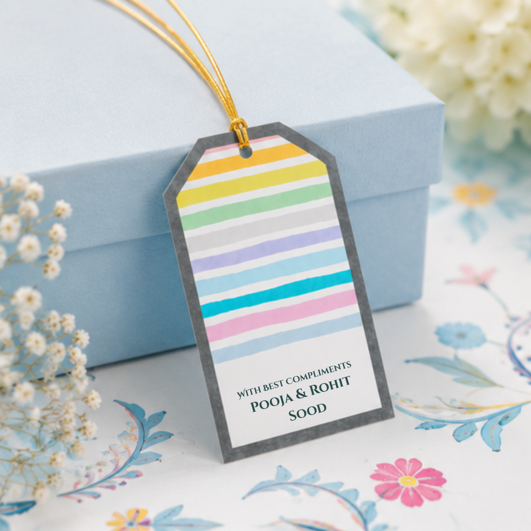 Pastel striped hanging gift tags with golden dori, styled on soft floral backgrounds for elegant and playful gifting.